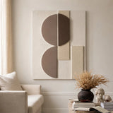 DUAL ARC Wall Art with geometric shapes styled above a beige sofa.