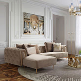 Modern living room with a beige sectional sofa, decorative pillows, and a chandelier.