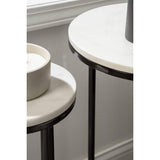 Two round side tables with white marble tops and black metal frames on a neutral background.