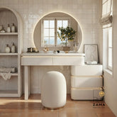 Modern black fluted makeup vanity set with round halo-lit mirror and matching dark stool.