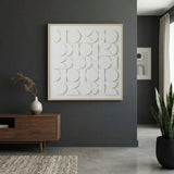 CERCLE Wall Art hanging above a wooden sideboard in a modern dark living room.