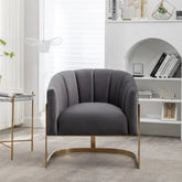 Gray armchair with gold legs in a modern living room setting