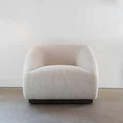 Beige armchair on a neutral background