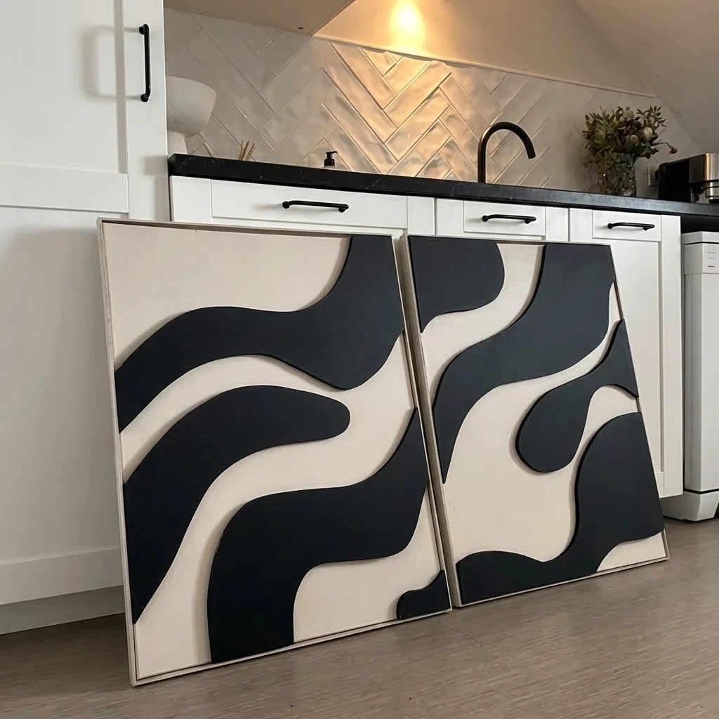 SELENE Wall Art leaning against a kitchen counter showing black and cream textured panels.