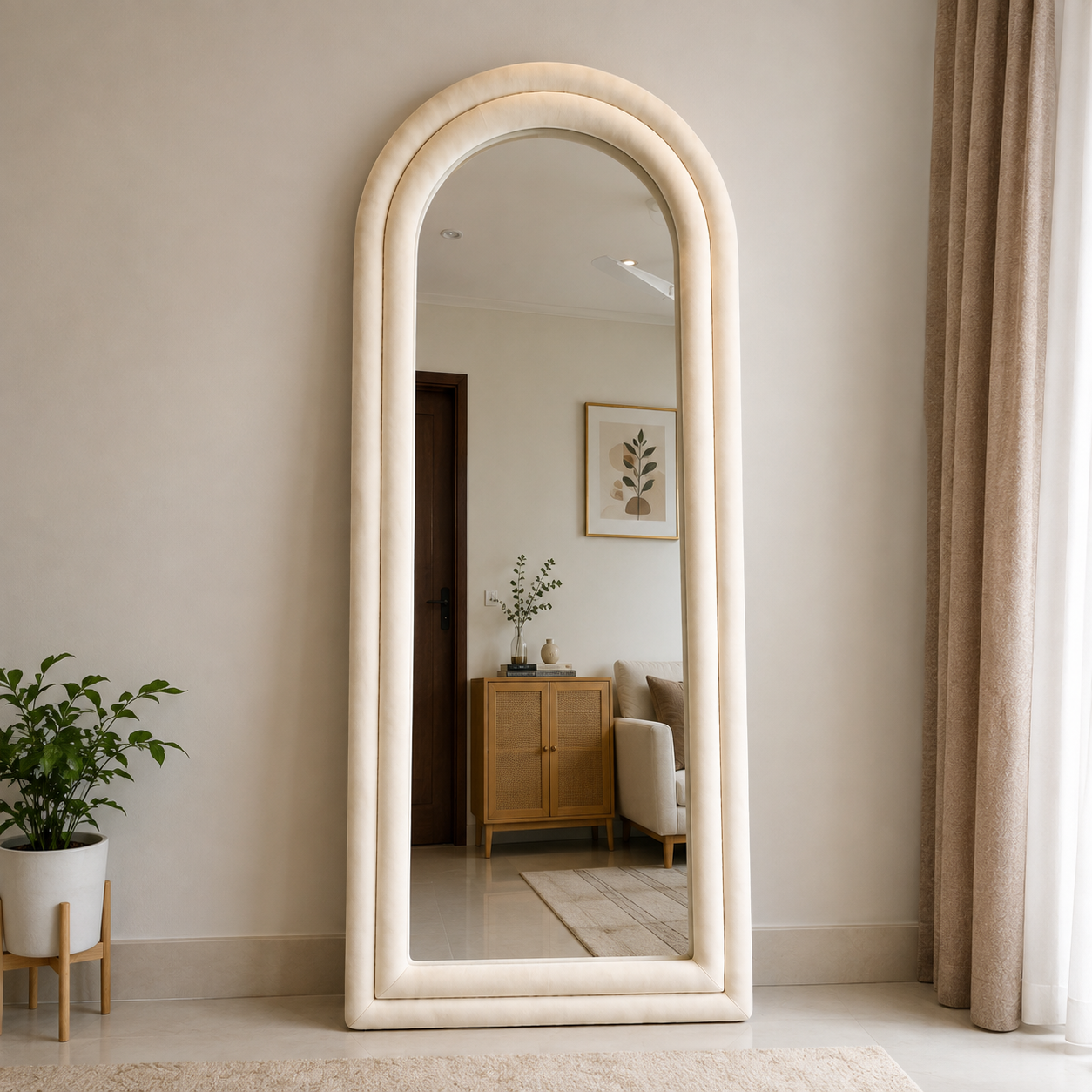 Tufted arched full-length mirror with cream padded frame for modern bedroom decor