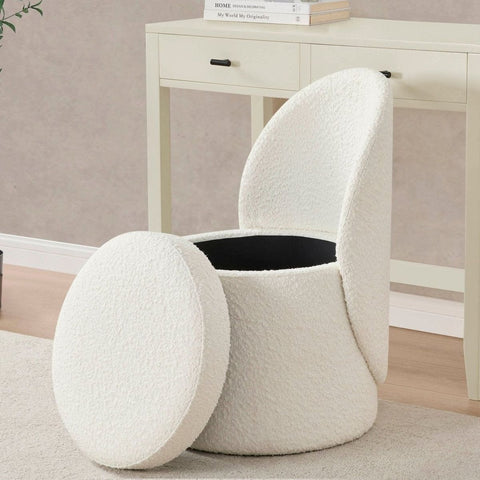 White textured ottoman with a black interior in a room setting.