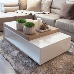 Modern living room with beige sectional sofa and a coffee table.