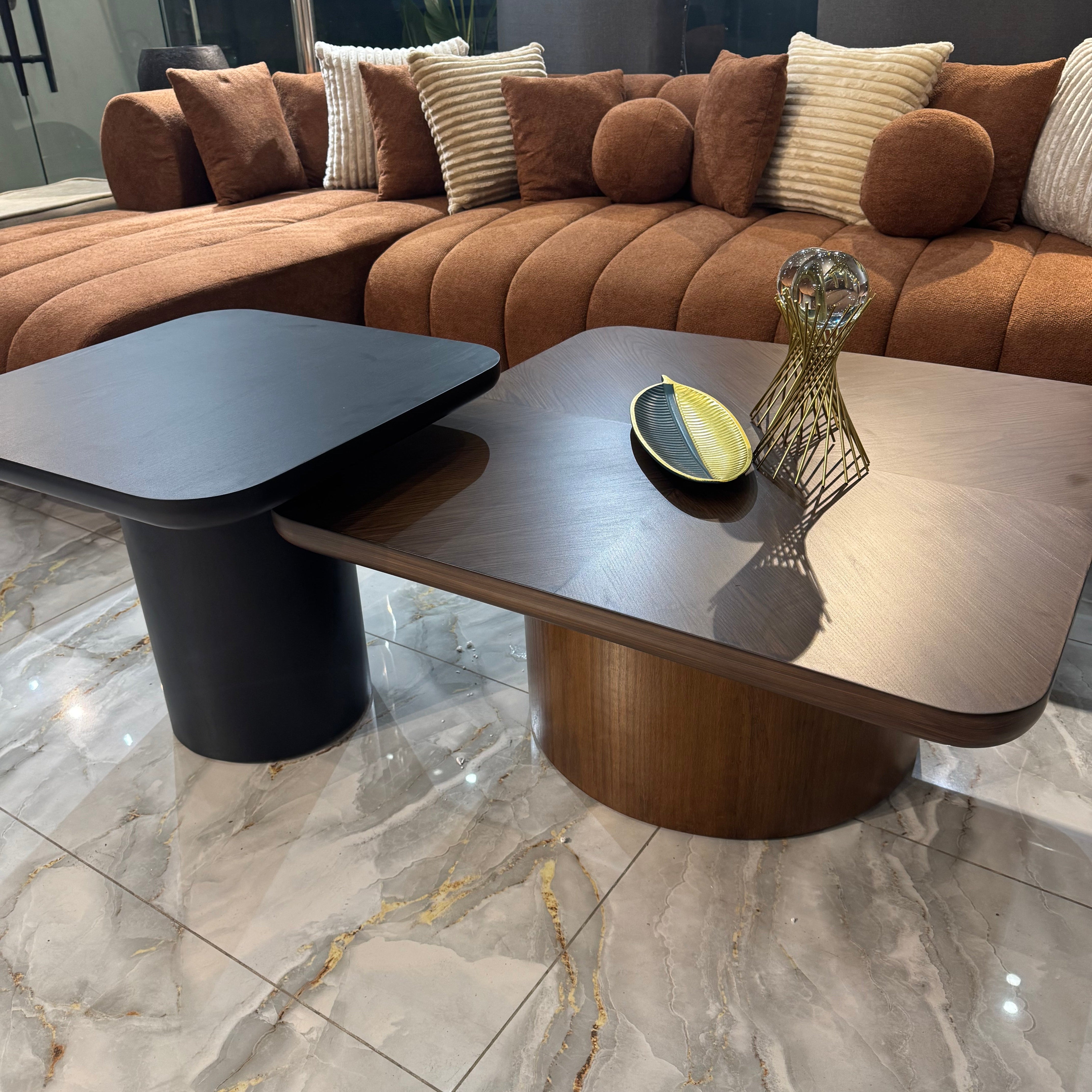 Brown sectional sofa with cushions in a modern living room setting.