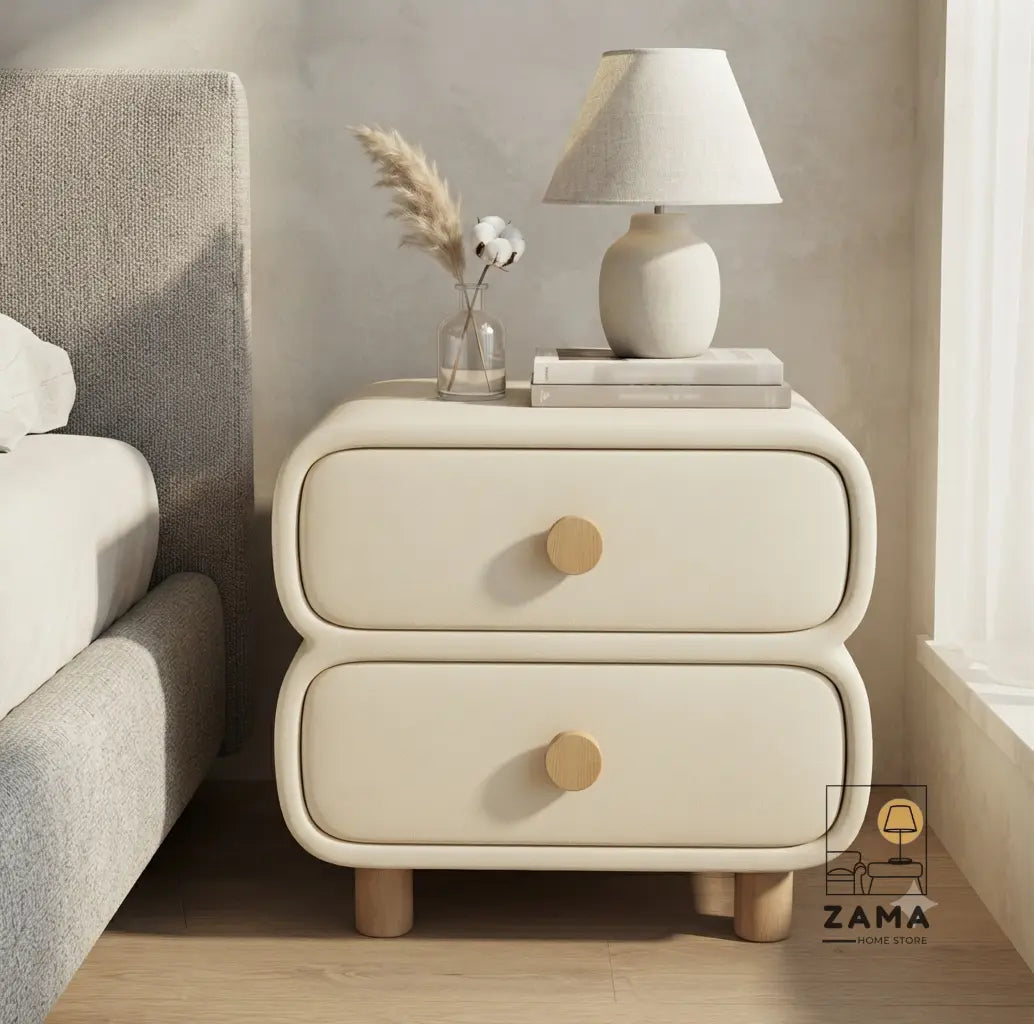 Premium two-drawer soft-edge bedside table styled on the right side of a neutral luxury bed with a minimalist lamp.