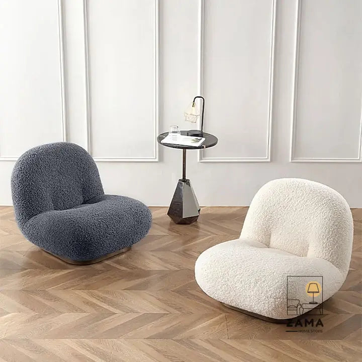 Modern interior featuring one Zama Home Store dark grey bouclé chair and one cream bouclé chair facing each other with a geometric side table.