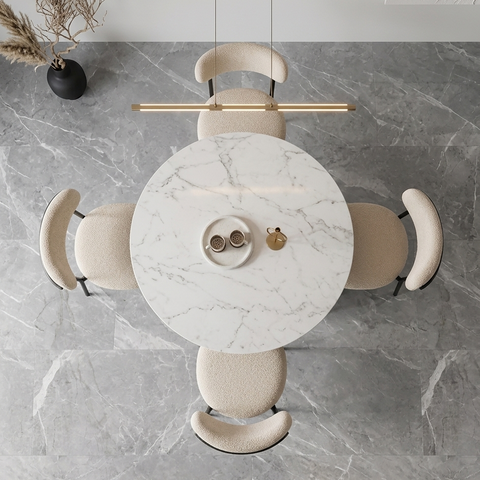 Modern pendant light fixture with marble-like surface on a gray marble background