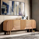 Elegant matte black Solstice Fluted Credenza by Zama Home Store, positioned on a patterned rug in a curated living space with modern home decor.