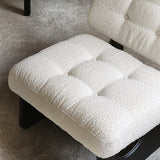 Close-up of a textured white cushion on a chair with a neutral background