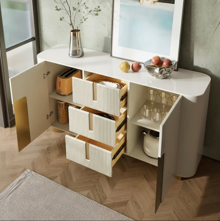 Modern kitchen island with open drawers and a decorative painting on the wall.