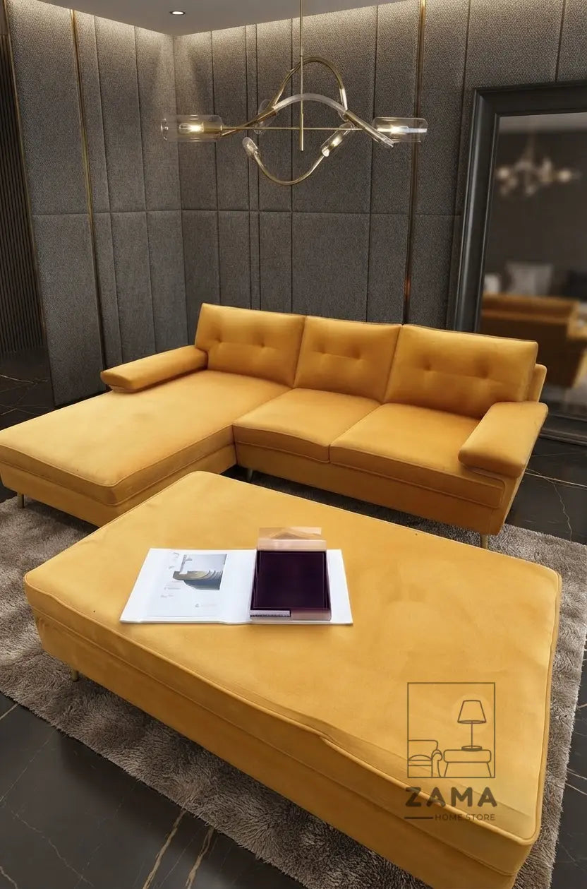 Mustard yellow velvet L-shape sectional sofa and matching ottoman with decor, from Zama Home Store.