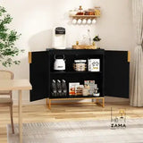 An open black and gold storage cabinet revealing its interior shelves stocked with a variety of pantry items, bottles, and a kettle, set within a dining room. Includes the Zama Home Store logo.