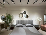 Decorative irregular pebble mirror wall-mounted in contemporary home interior