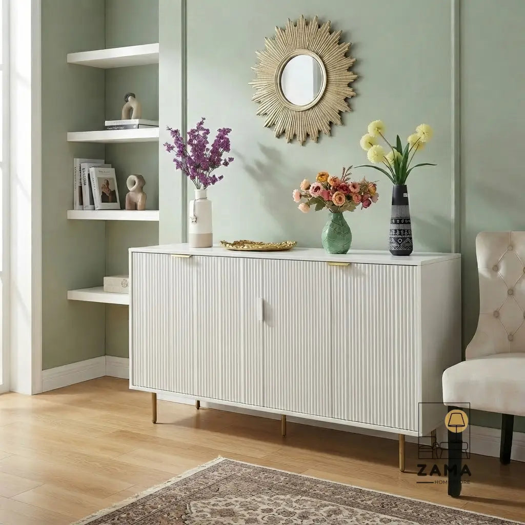 Quinn white fluted sideboard styled in a luxury living room with green paneled walls and decor.