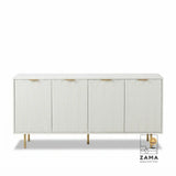 Studio shot of the 4-door Quinn white fluted sideboard with gold hardware on a plain background.