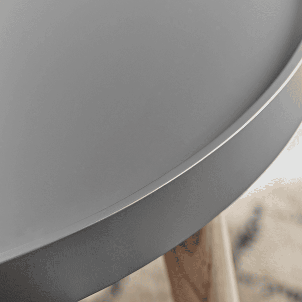 Close-up of a gray round table with a blurred background