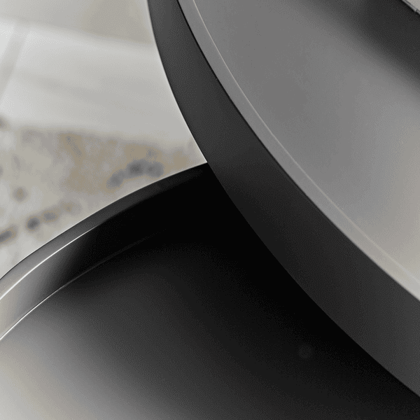 Close-up of a modern black round table with a blurred background