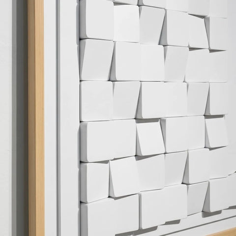 Close-up of Luxora Grid Wall Art showing the textured 3D white blocks and natural oak frame details.