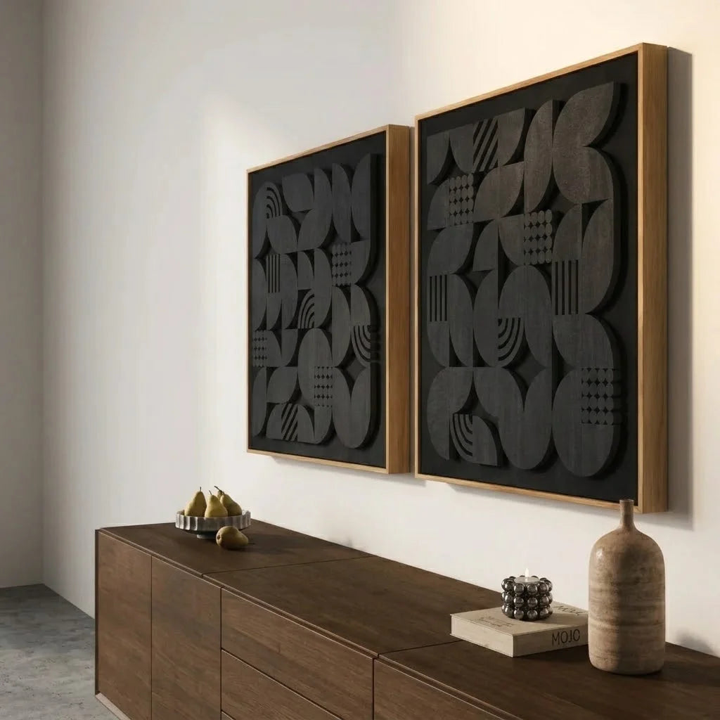 Angled view of NERO Wall Art showing black raised geometric shapes above a dark wood cabinet.