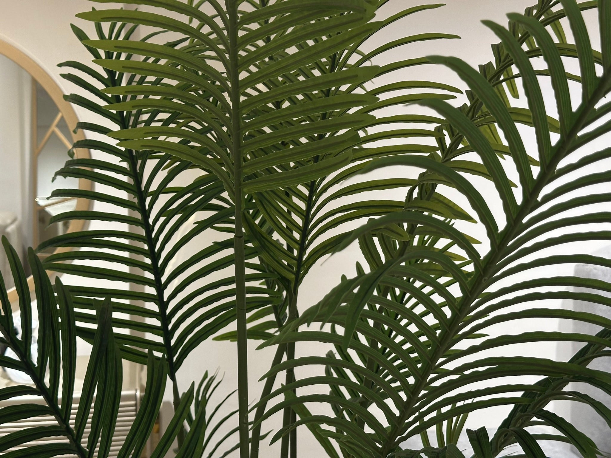 Artificial palm plant home decor close up