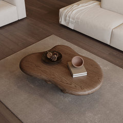 Wooden coffee table with decorative items in a living room setting