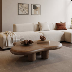Modern living room with a wooden coffee table and beige sofa.