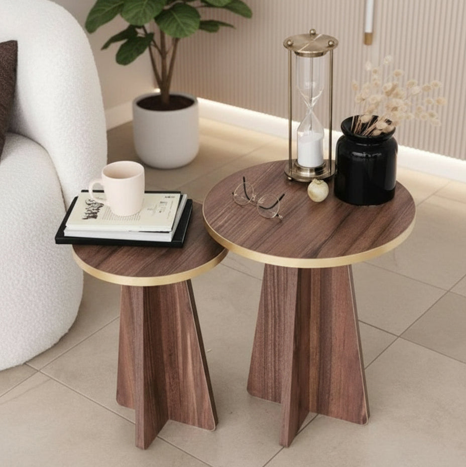 Two wooden side tables with gold accents in a living room setting.