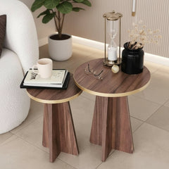 Two wooden side tables with gold accents in a living room setting.