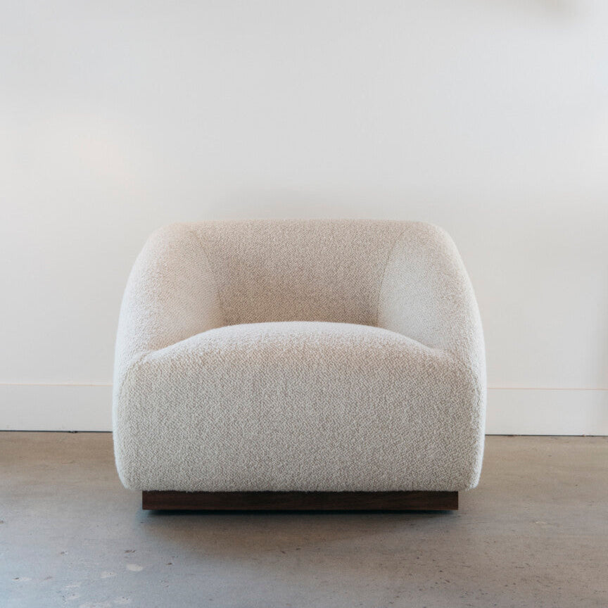 Beige armchair on a neutral background