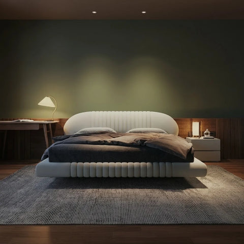 Front view of Zama Home Store Bean boucle bed against a dark wall with warm lighting