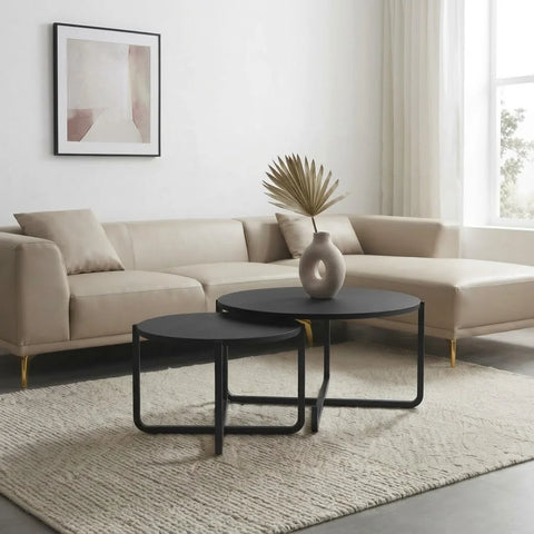 Black nesting coffee tables with veneer top by Zama Home Store in a modern living room