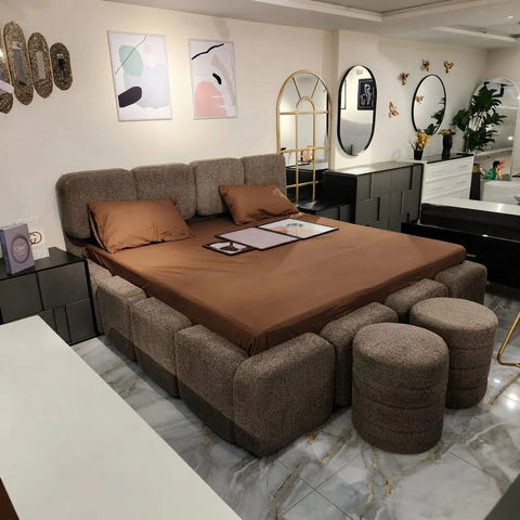 Bob boucle bed by Zama Home Store with matching ottomans in a modern bedroom