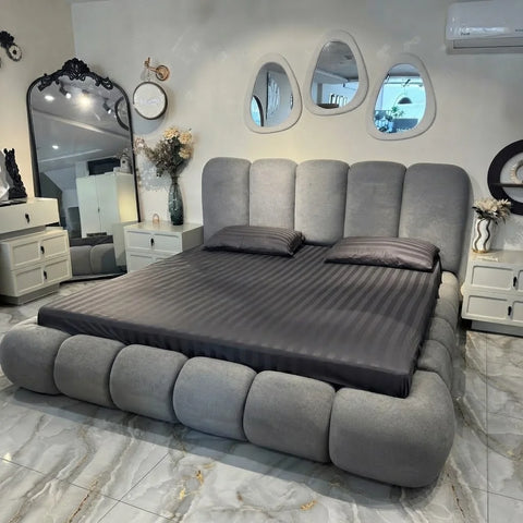 Angled view of Zama Home Store Bubble Bed in a luxury room with a mirror