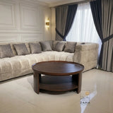 Modern oval center table by Zama Home Store in a luxury living room with a cream sofa