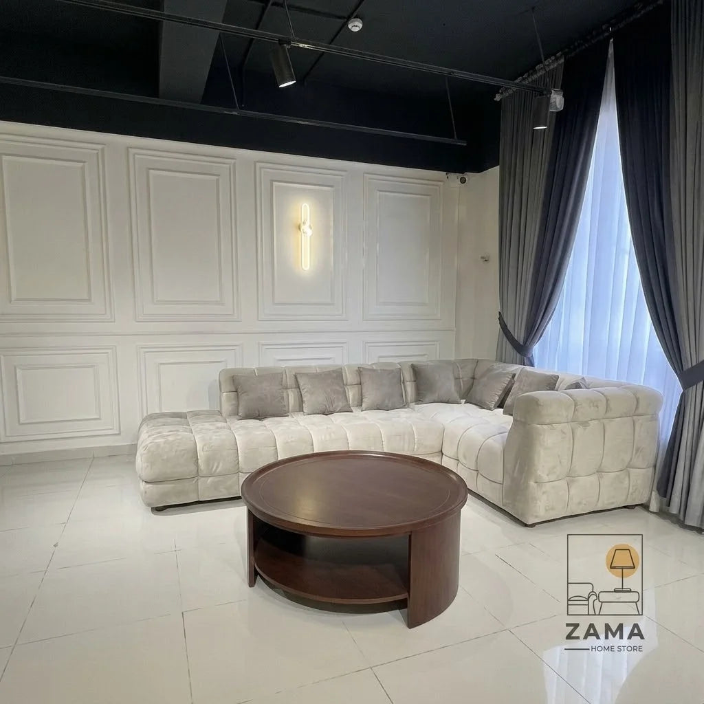 Side angle of Zama Home Store oval center table in a modern room with grey sofa
