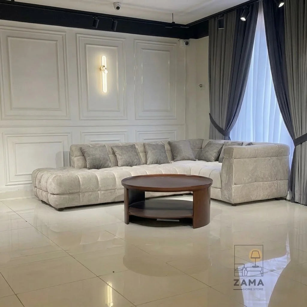 Wide view of Zama Home Store oval center table with cream sofa in a modern room