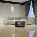 Wide view of Zama Home Store oval center table with cream sofa in a modern room