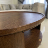 Close-up of the wood texture and edge of Zama Home Store oval center table